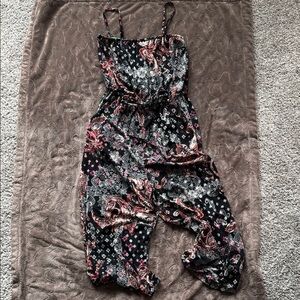 Maurice’s. Floral Black cropped Jumpsuit. Never worn. Size medium